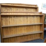 Two large modern pine wall racks. The largest 183 cm wide.