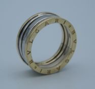 A 14 ct gold bi-colour ring. Ring size Q (5.