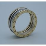 A 14 ct gold bi-colour ring. Ring size Q (5.