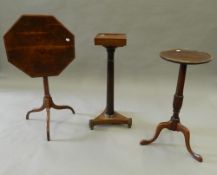 Three mahogany tripod tables. The largest 46.5 cm wide.