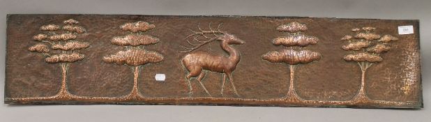 A large Arts and Crafts beaten copper panel. 107 cm long.