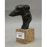 A patinated bronze greyhound bust on stand. 13 cm high.