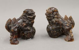 A pair of Chinese carved temple dogs. 10 cm high.