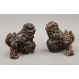 A pair of Chinese carved temple dogs. 10 cm high.