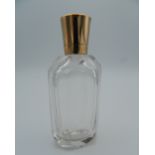 An 18 ct gold topped scent bottle. 8.25 cm high.