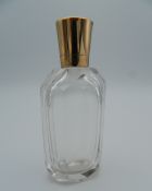 An 18 ct gold topped scent bottle. 8.25 cm high.