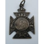 A Queen Victoria medallion. 2.5 cm wide.