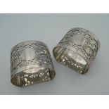A pair of silver napkin rings with pierced acorn decoration. (65.
