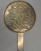 A Japanese bronze hand mirror. 18 cm wide.