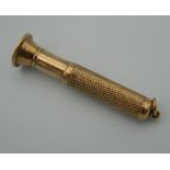 A 9 ct gold cigar pricker. 6.5 cm long (16.