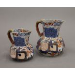 Two 19th century Davenport Imari pattern jugs. The largest 11 cm high.