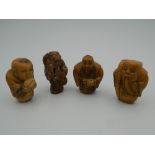 A set of four bone carved netsukes. Each approximately 3.5 cm high.