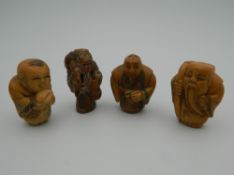 A set of four bone carved netsukes. Each approximately 3.5 cm high.