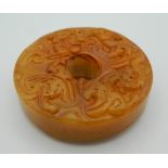 A Chinese toffee jade roundel. 5.5 cm diameter.