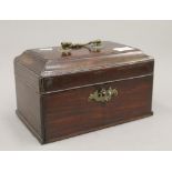 A Georgian mahogany tea caddy with fitted interior. 24 cm wide.