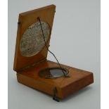 A 19th century cased sun dial and compass