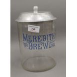 A Meredith and Drew shop counter biscuit jar. 23 cm high.