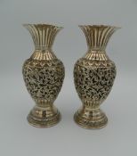 A pair of Eastern, possibly Persian, unmarked silver vases. 17.5 cm high (17.3 troy ounces).