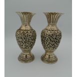 A pair of Eastern, possibly Persian, unmarked silver vases. 17.5 cm high (17.3 troy ounces).