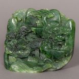 A Chinese jade boulder carving, formed as a sagely figure,