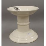 A white porcelain ham stand, inscribed ''G Rushbrooke Smithfield LTD''. 19.5 cm high.