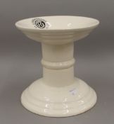 A white porcelain ham stand, inscribed ''G Rushbrooke Smithfield LTD''. 19.5 cm high.