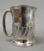 A silver Christening mug. 9.5 cm high (5.