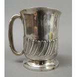 A silver Christening mug. 9.5 cm high (5.