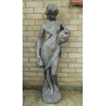 A garden statue of a young girl. 127 cm high.