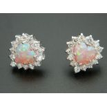 A pair of silver and opal earrings