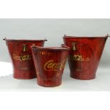 A set of 'Coca-Cola' buckets. The largest 33.5 cm high.