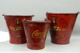 A set of 'Coca-Cola' buckets. The largest 33.5 cm high.