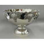 A silver plated punch bowl decorated with grapes. 38 cm diameter.
