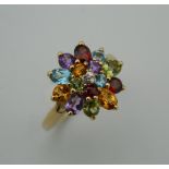 A 9 ct gold multi-gem set ring. Ring size K.