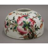 A Chinese porcelain brush washer decorated with peaches. 12.5 cm diameter.