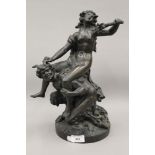 A 19th century patinated bronze model of a woman riding a satyr. 38 cm high.