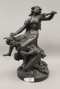 A 19th century patinated bronze model of a woman riding a satyr. 38 cm high.