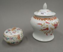 A 19th century Chinese porcelain baluster vase and cover painted with pink flowers and iron red