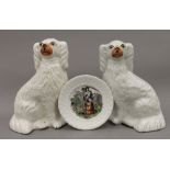 A pair of 19th century pottery Staffordshire spaniels and a child's nursery plate entitled 'May'.