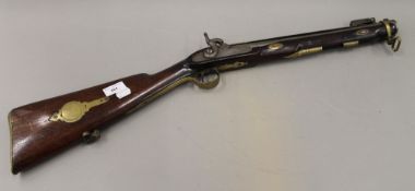 A percussion cap blunderbuss with spring loaded bayonet,
