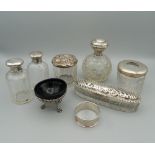 A quantity of various silver mounted dressing table jars, etc.