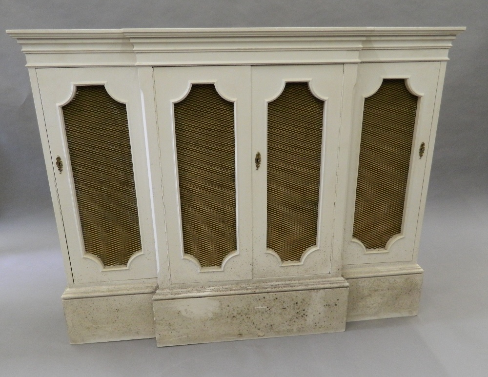 A modern white painted break front side cabinet. 127.5 cm wide.