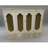 A modern white painted break front side cabinet. 127.5 cm wide.