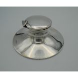 A silver Capstan inkwell, hallmarked for Birmingham, circa 1900. 11.5 cm wide.