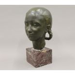 GEORGES GORI (circa 1930) French, a patinated bronze female bust on a marble plinth. 33 cm high.