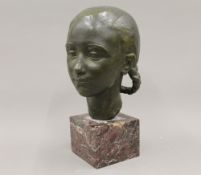 GEORGES GORI (circa 1930) French, a patinated bronze female bust on a marble plinth. 33 cm high.