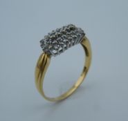 An 18 ct gold diamond cluster ring, set with 0.5 carat of diamonds. Ring size W (4.