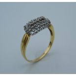 An 18 ct gold diamond cluster ring, set with 0.5 carat of diamonds. Ring size W (4.