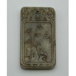 A rectangular jade pendant, decorated with calligraphy. 6 cm high.