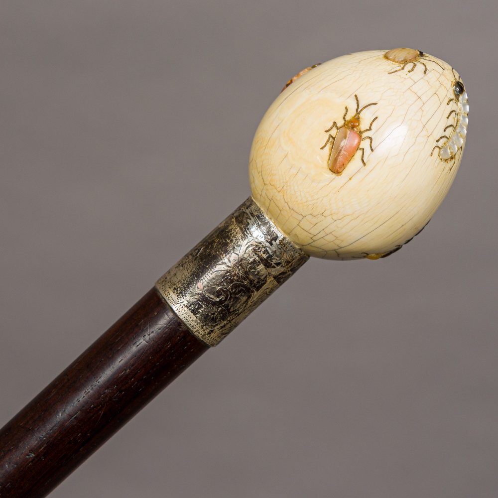 A Victorian walking stick, set with shibayama inlaid ivory handle. 87.5 cm long.